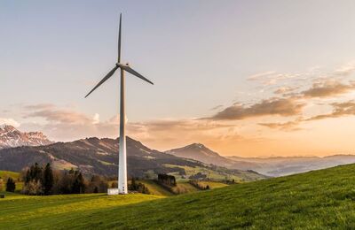 Wind turbine in front of mountain landscape
