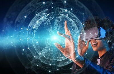 Woman reaches for a holographic representation and wears VR glasses