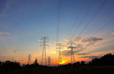 Power transmission lines at sunrise